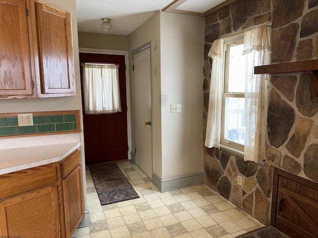 kitchen with a textured ceiling