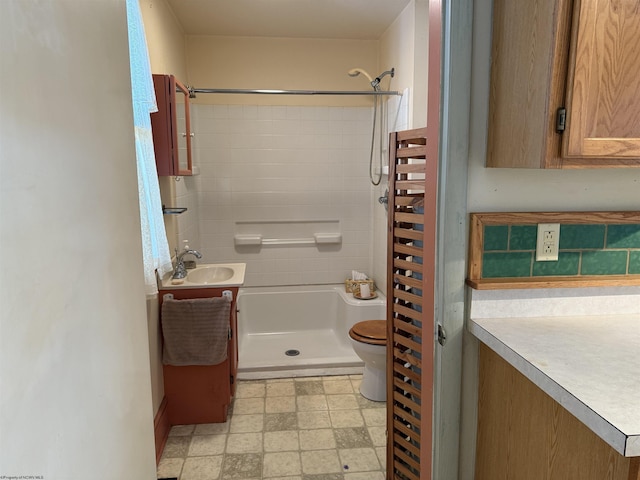 bathroom featuring toilet, a shower, radiator heating unit, and vanity