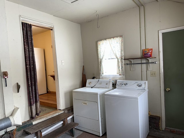 laundry room featuring washing machine and clothes dryer