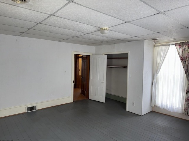 unfurnished bedroom featuring hardwood / wood-style flooring and a closet