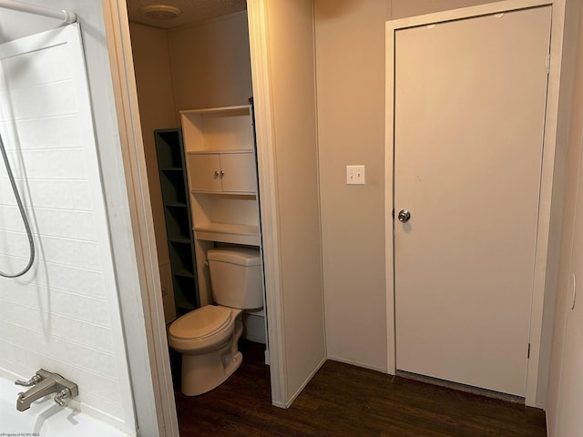 bathroom featuring hardwood / wood-style floors and toilet