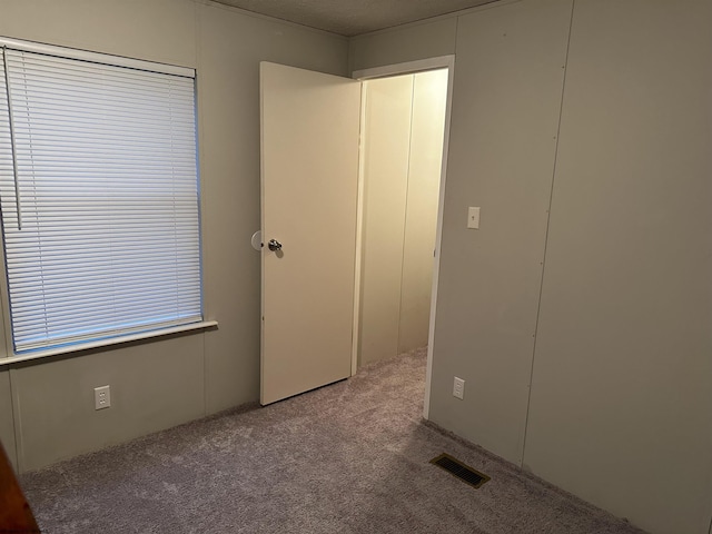 unfurnished bedroom with carpet