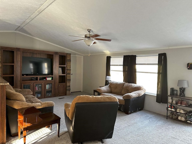 living room with light colored carpet, lofted ceiling, a textured ceiling, and ornamental molding