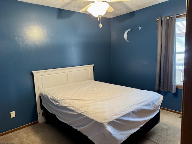 bedroom with ceiling fan and carpet