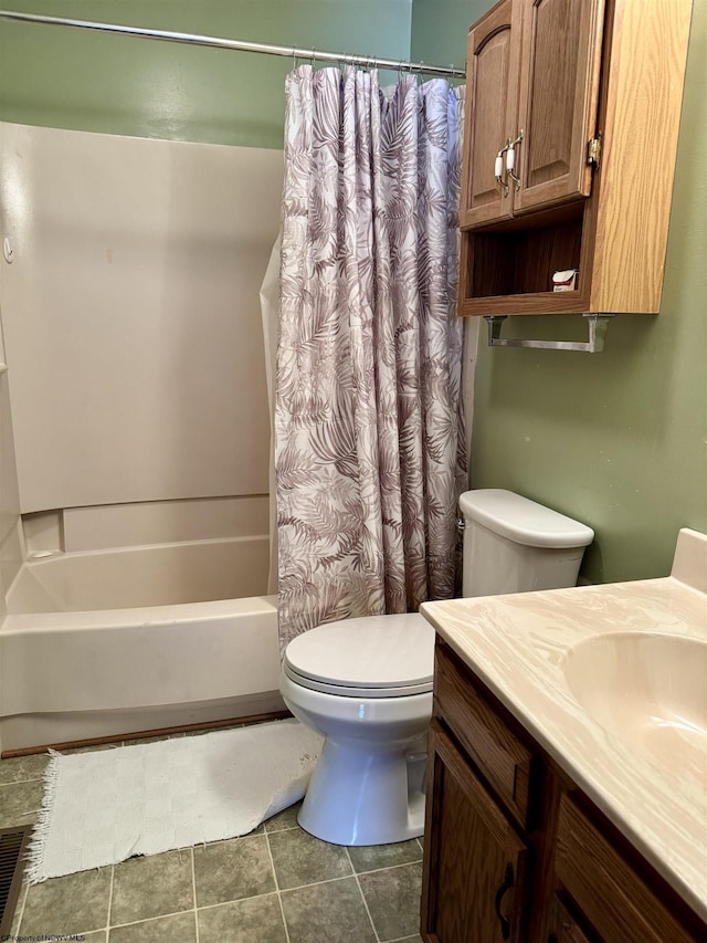 full bathroom with vanity, shower / tub combo, and toilet