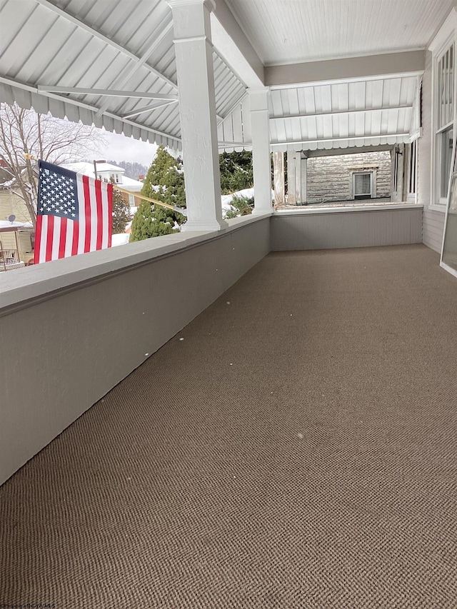 unfurnished sunroom featuring lofted ceiling