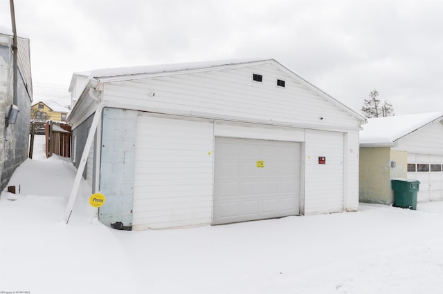 view of snow covered garage