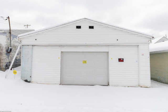 view of snow covered garage