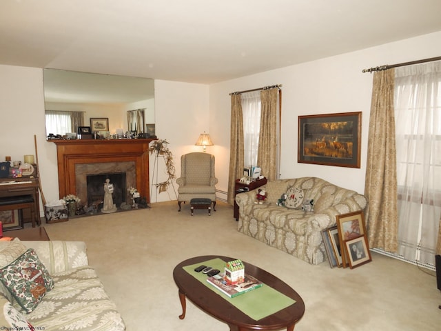 carpeted living room with a high end fireplace