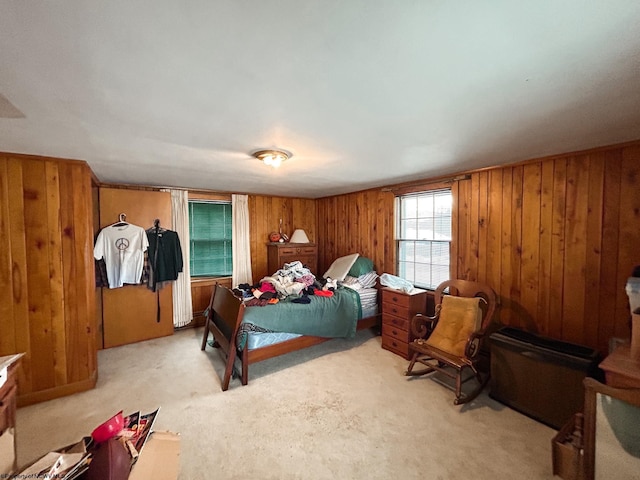 carpeted bedroom with wooden walls