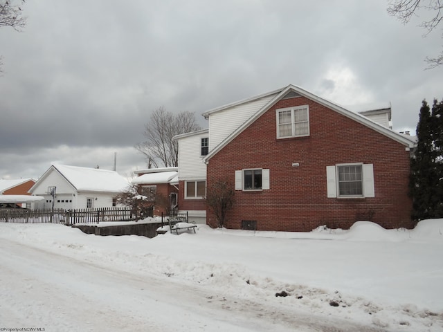 view of snow covered house