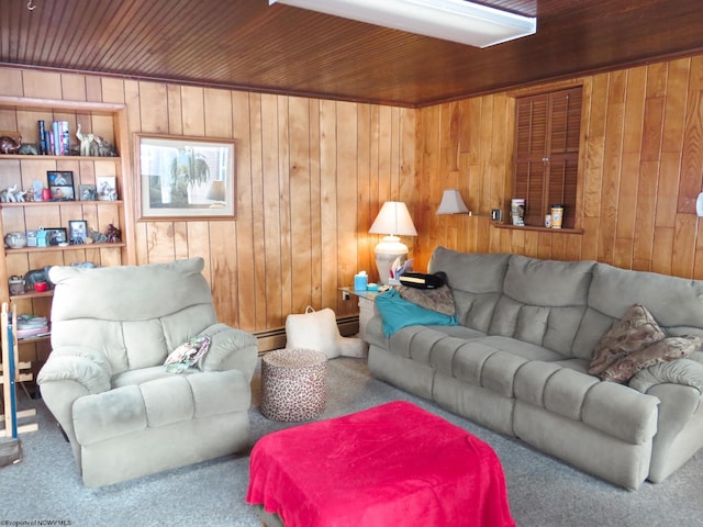 carpeted living room featuring a baseboard heating unit and wood walls