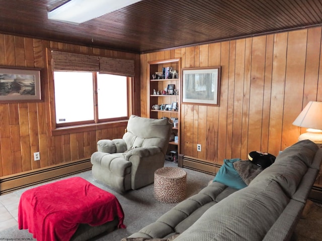 living room with wooden walls, baseboard heating, built in shelves, and wood ceiling