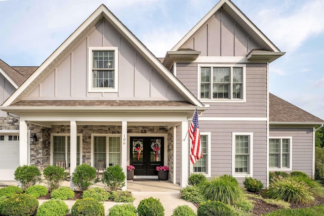 view of front of home featuring a porch and a garage