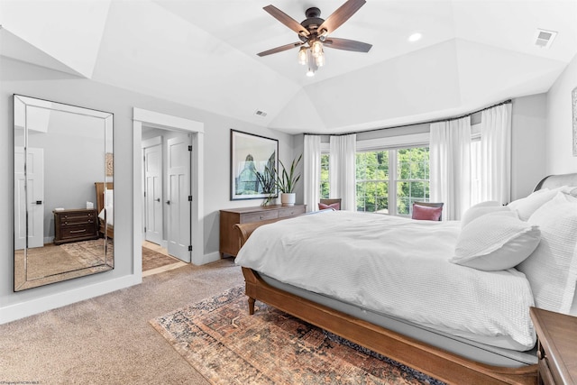 carpeted bedroom featuring lofted ceiling and ceiling fan