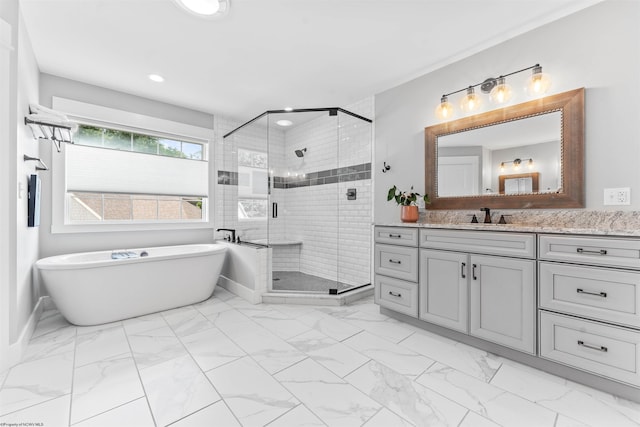 bathroom featuring vanity and shower with separate bathtub