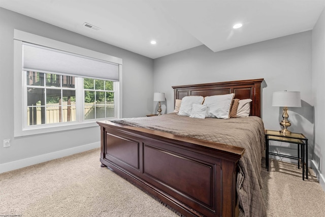 bedroom with light colored carpet