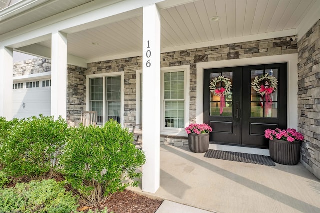 doorway to property with french doors and covered porch