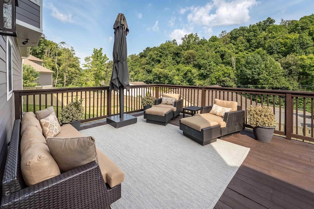 wooden deck with an outdoor living space