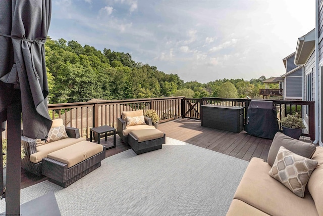 wooden terrace featuring area for grilling