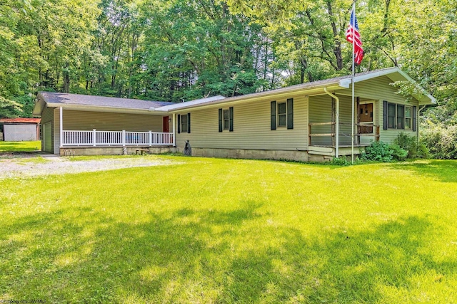 view of front of house featuring a front yard and covered porch