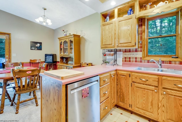 kitchen featuring an inviting chandelier, kitchen peninsula, sink, decorative light fixtures, and stainless steel dishwasher