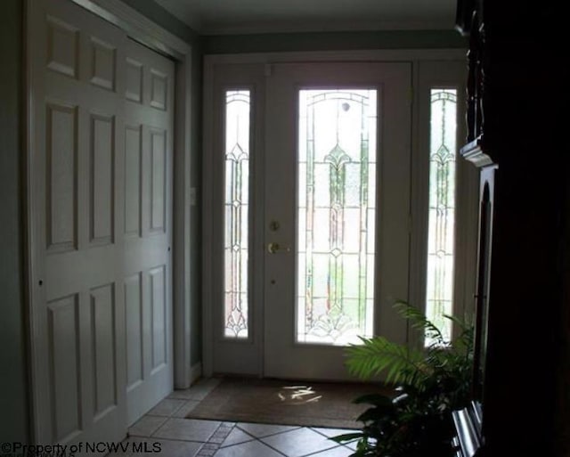 foyer with light tile patterned floors