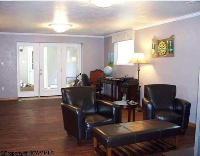 sitting room with wood finished floors and ornamental molding