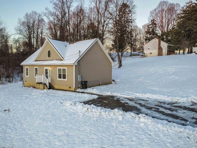 view of snow covered house