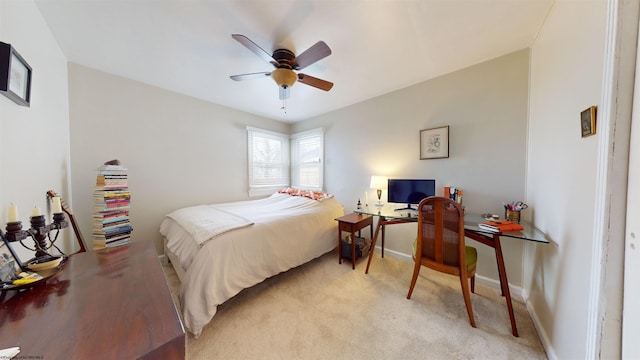 bedroom with light colored carpet and ceiling fan