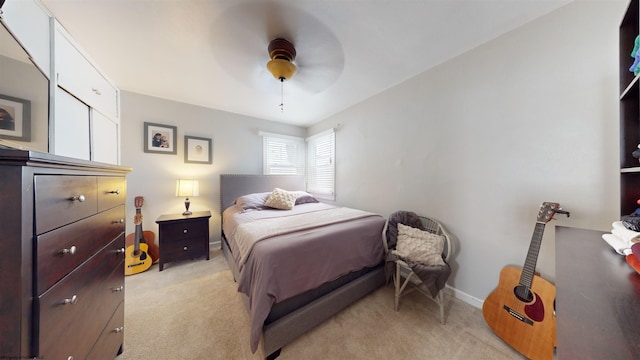 bedroom featuring ceiling fan and light colored carpet