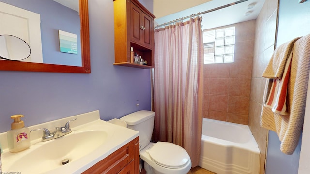 full bathroom featuring toilet, vanity, and shower / bath combo