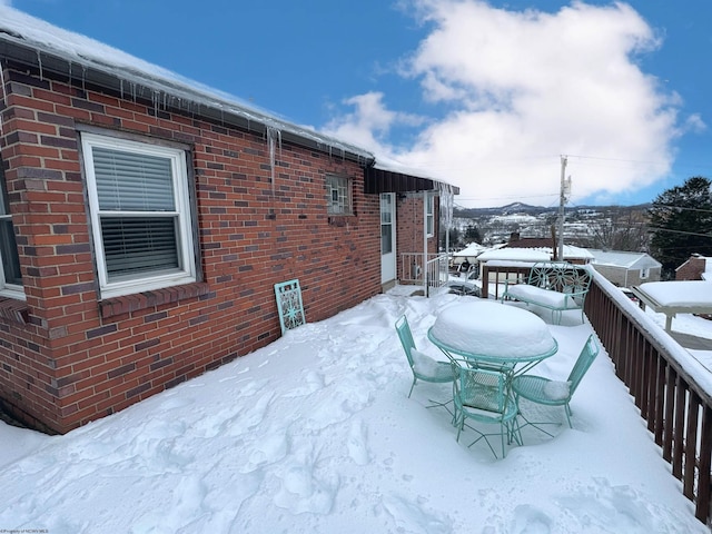 view of snow covered deck