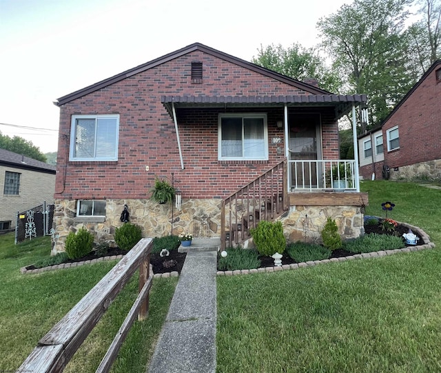 bungalow-style home with a porch and a front lawn