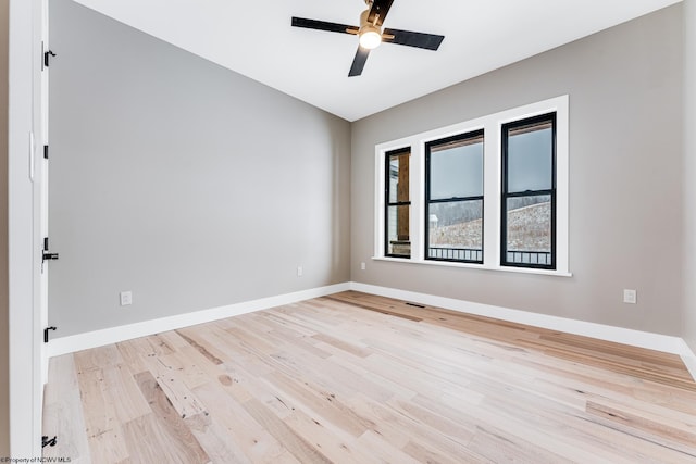 unfurnished room featuring ceiling fan and light hardwood / wood-style floors