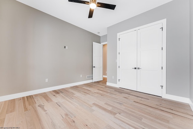 unfurnished bedroom featuring a closet, ceiling fan, and light hardwood / wood-style flooring