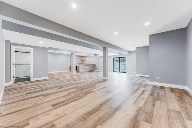 unfurnished living room with light hardwood / wood-style flooring