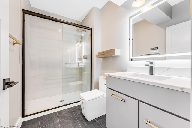 bathroom featuring toilet, tile patterned floors, walk in shower, and vanity