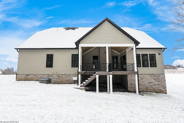 view of snow covered house