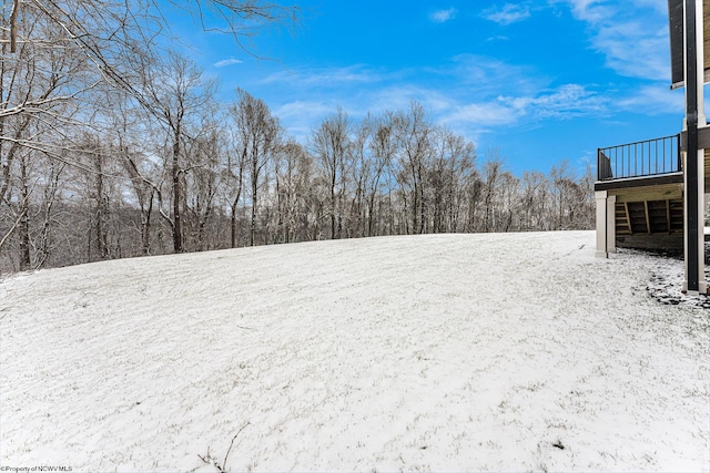 view of yard layered in snow