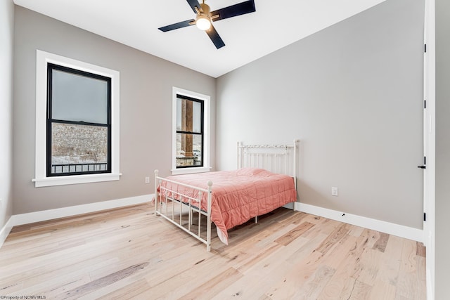 bedroom featuring light wood-type flooring and ceiling fan