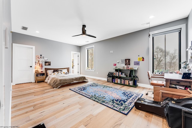 bedroom with hardwood / wood-style floors and ceiling fan