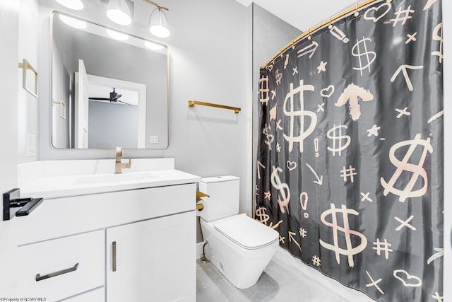 bathroom with curtained shower, vanity, and toilet