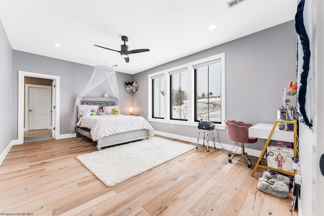 bedroom featuring ceiling fan and light hardwood / wood-style flooring