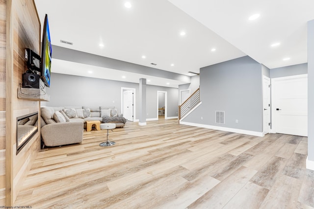 living room with light hardwood / wood-style floors