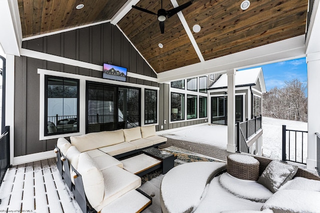 sunroom / solarium with ceiling fan, wooden ceiling, and lofted ceiling