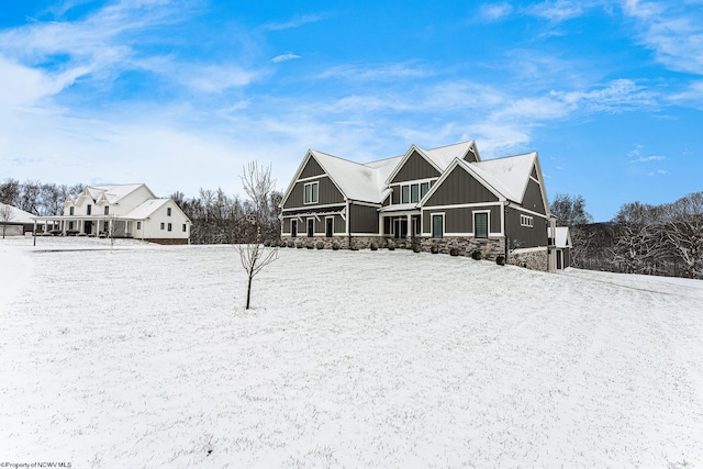 view of snow covered house