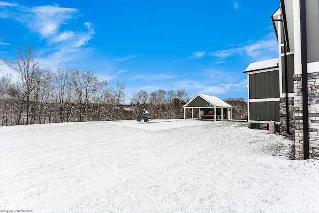 view of yard layered in snow