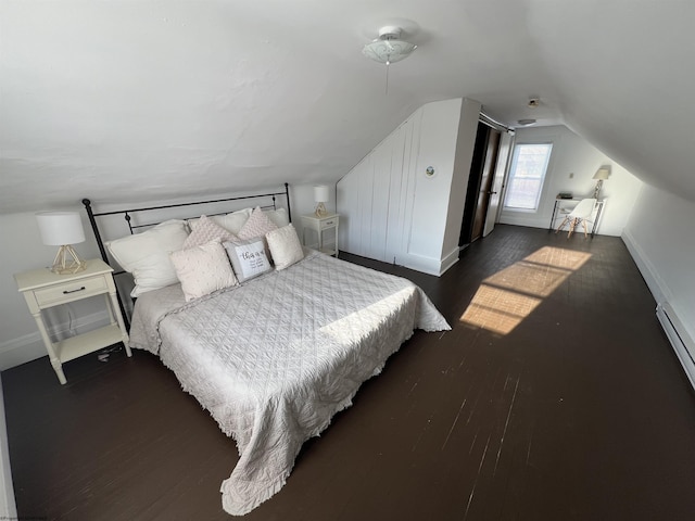 bedroom featuring vaulted ceiling and dark hardwood / wood-style floors