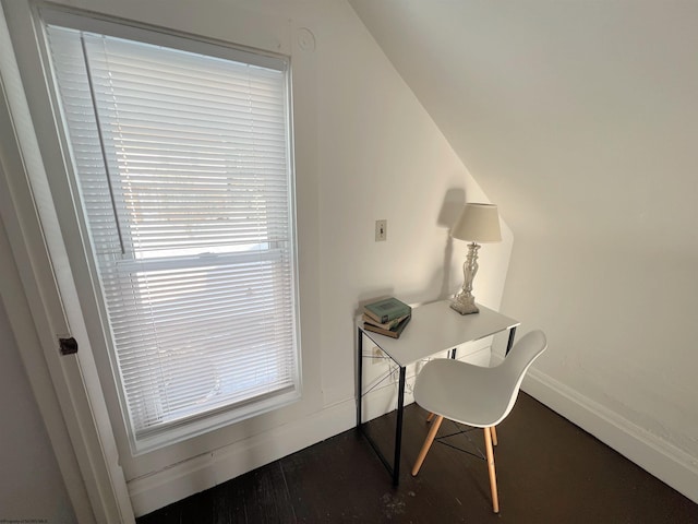 office with lofted ceiling, hardwood / wood-style flooring, and a healthy amount of sunlight